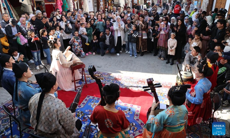 Moroccan people enjoy traditional Chinese folk music during a cultural event marking the coming Chinese Spring Festival in Rabat, Morocco on Jan. 24, 2024.(Photo: Xinhua)