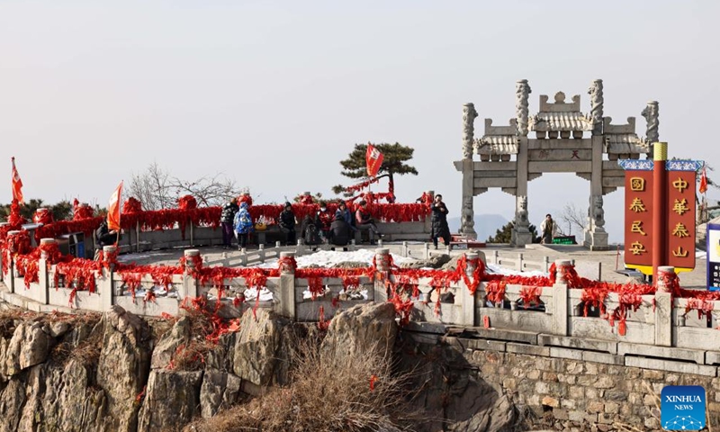 Tourists visit the Mount Tai scenic area in east China's Shandong Province, Jan. 26, 2024. With its natural and cultural values well interconnected, Mount Tai was listed as a World Cultural and Natural Heritage site by UNESCO in 1987, the first ever in China. In 2023, the Mount Tai scenic area received over 8.61 million visitors, a new record over the years. (Xinhua/Zhu Zheng)