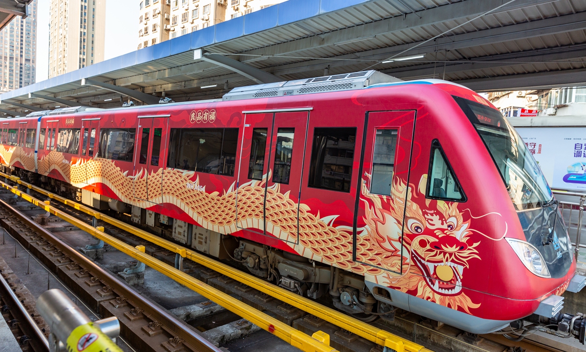 A subway train with a Chinese dragon design passes through a subway platform in Wuhan, Central China's Hubei Province, on January 28, 2024. The Year of the Dragon trains were put into operation earlier that day. Photo: VCG