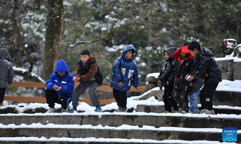 Children have a snowball fight at Dangjiu Village in Gandong Township of Rongshui Miao Autonomous County, south China's Guangxi Zhuang Autonomous Region, Jan. 24, 2024. Miao ethnic people in high mountainous villages of Liuzhou are busy preparing celebratory merchandise, hosting feasts, and rehearsing festive events ahead of the upcoming Chinese New Year despite the freezing weather. (Xinhua/Huang Xiaobang)