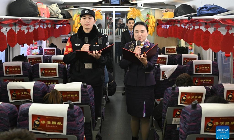 Staff members perform a poetry recital onboard G7575 bullet train, Jan. 29, 2024. A series of traditional cultural activities, such as opera performance and paper cutting show, were held on the bullet train on Monday. China officially ushered in its largest annual population migration on Jan. 26. The 40-day travel surge, also known as chunyun, will see hundreds of millions of people return home and reunite with their friends and families.(Photo: Xinhua)