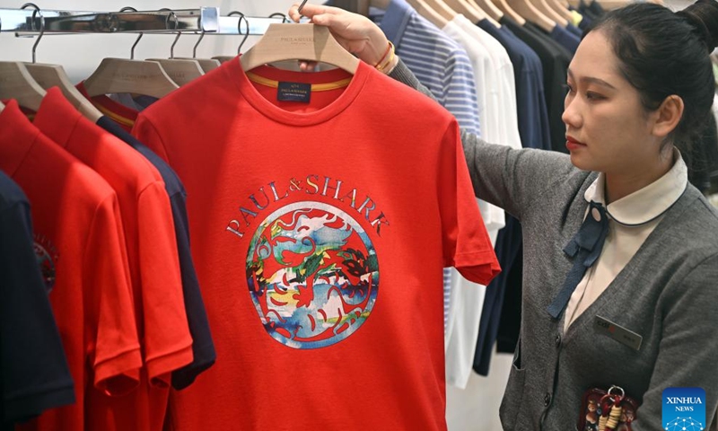 A dragon-themed T-shirt is pictured at Haikou Riyue Plaza Duty Free Shop in Haikou, south China's Hainan Province, Jan. 27, 2024. Various kinds of dragon-themed decorations and products are seen at the duty-free malls in Haikou as the 2024 Chinese Lunar New Year, the Year of the Dragon, is coming.(Photo: Xinhua)