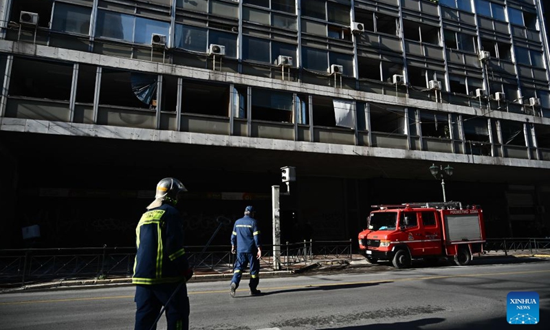 Firefighters are seen at the Ministry of Labor and Social Affairs after a bomb exploded opposite the ministry building in Athens, Greece, Feb. 3, 2024. A bomb exploded opposite the Ministry of Labor and Social Affairs in central Athens on Saturday, causing extensive material damage, but no injuries, Greek national broadcaster ERT reported. (Xinhua/Marios Lolos)