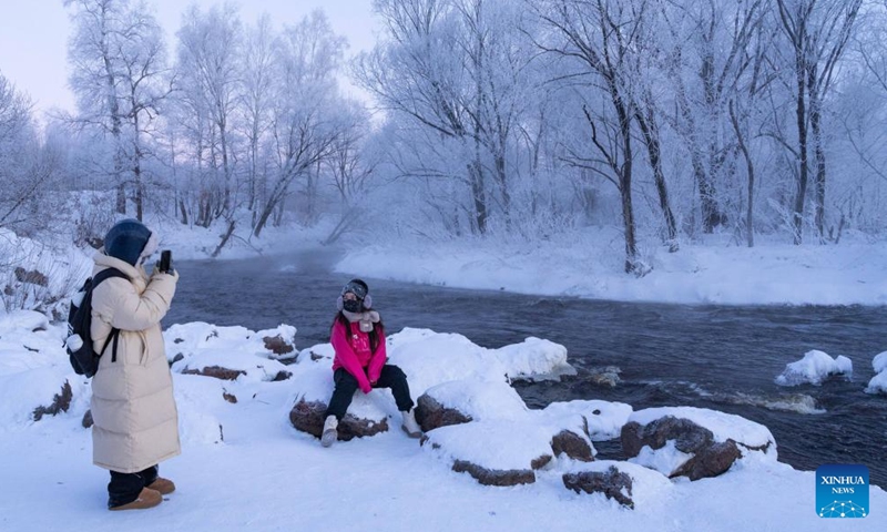 Tourists enjoy the rime scenery along the Kurbin River near Pingtai Village in Xunke County of Heihe, northeast China's Heilongjiang Province, Feb. 2, 2024.