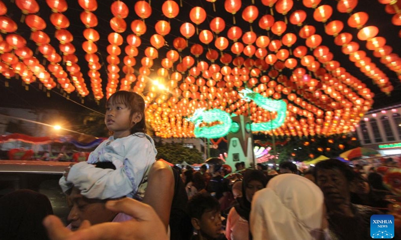 People enjoy light decorations during Chinese Lunar New Year celebration at Surakarta, Central Java, Indonesia, on Feb. 10, 2024. (Photo by Bram Selo/Xinhua)