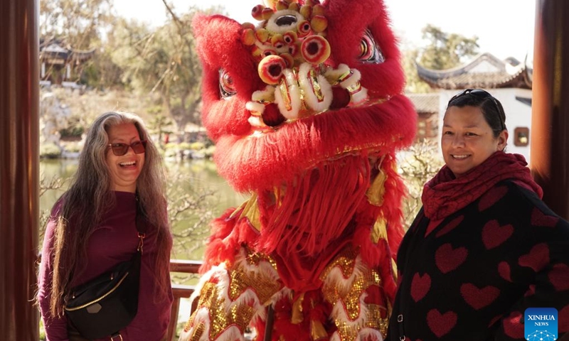 People attend a Chinese New Year festival at the Huntington Library, Art Museum and Botanical Gardens in Southern California, the United States, Feb. 10, 2024. A series of Chinese Lunar New Year celebrations was held Saturday in Southern California, which is home to most Chinese Americans in the United States. Many people told Xinhua they expected more cultural exchanges between the two countries. (Photo by Zeng Hui/Xinhua)