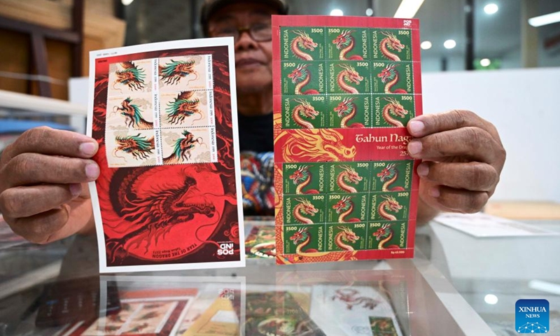 Series of postage stamps in celebration of the upcoming Chinese Lunar New Year, or the Year of the Dragon, are seen at a PT Pos Indonesia office in Jakarta, Indonesia, Feb. 6, 2024. The stamps were issued by Indonesian state-owned postal service company PT Pos Indonesia and the country's Ministry of Communications and Informatics on Friday.(Photo: Xinhua)