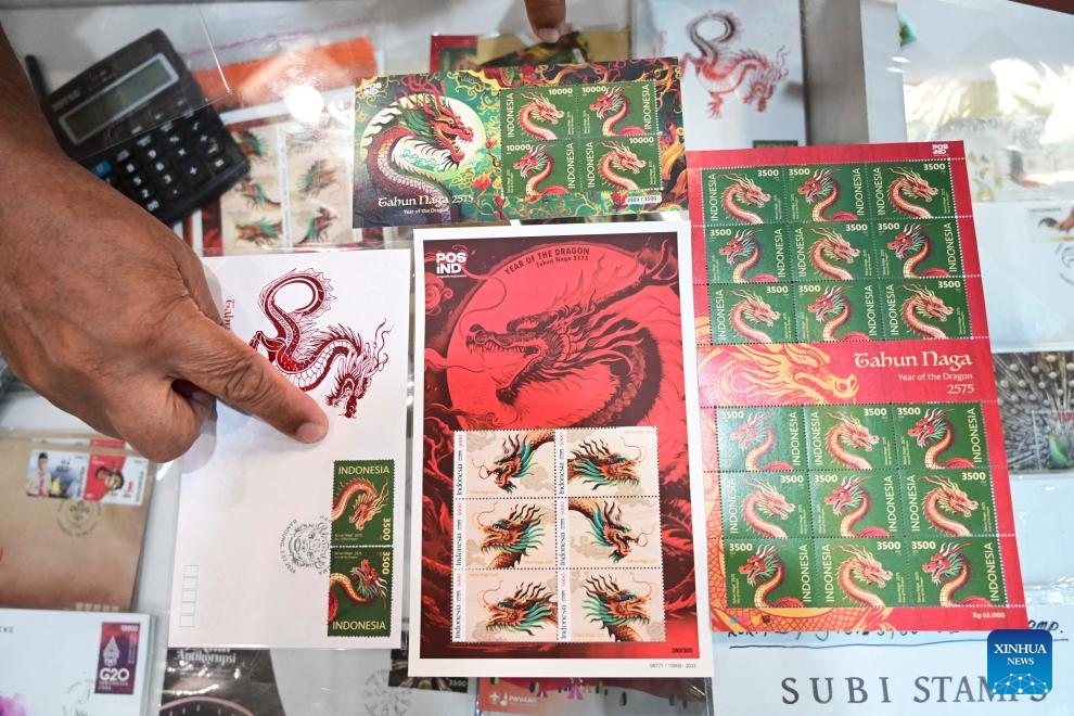 Series of postage stamps in celebration of the upcoming Chinese Lunar New Year, or the Year of the Dragon, are seen at a PT Pos Indonesia office in Jakarta, Indonesia, Feb. 6, 2024. The stamps were issued by Indonesian state-owned postal service company PT Pos Indonesia and the country's Ministry of Communications and Informatics on Friday.(Photo: Xinhua)