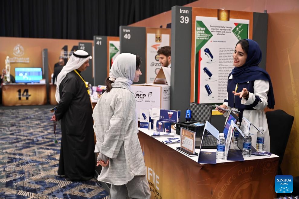 People visit the 14th International Invention Fair in the Middle East in Kuwait City, Kuwait, Feb. 5, 2024. The 14th International Invention Fair in the Middle East (IIFME) took place from Feb. 4 to Feb. 7 in Kuwait.(Photo: Xinhua)