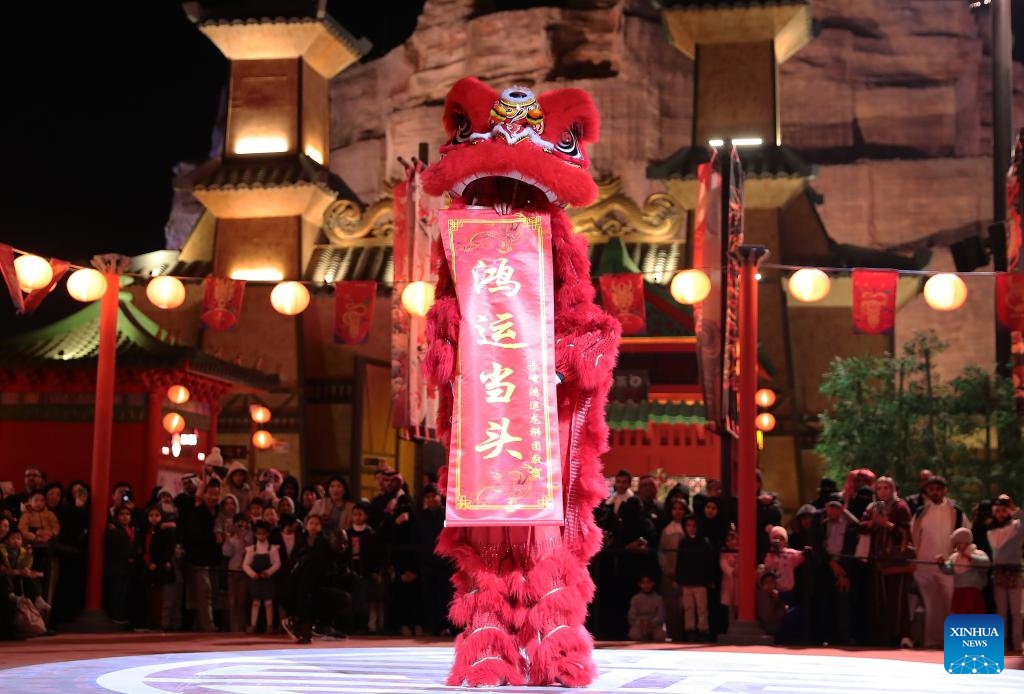 People watch lion dance during an event celebrating the upcoming Chinese Lunar New Year, or the Spring Festival, at the Chinatown of the Boulevard World in Riyadh, Saudi Arabia, on Feb. 5, 2024.(Photo: Xinhua)