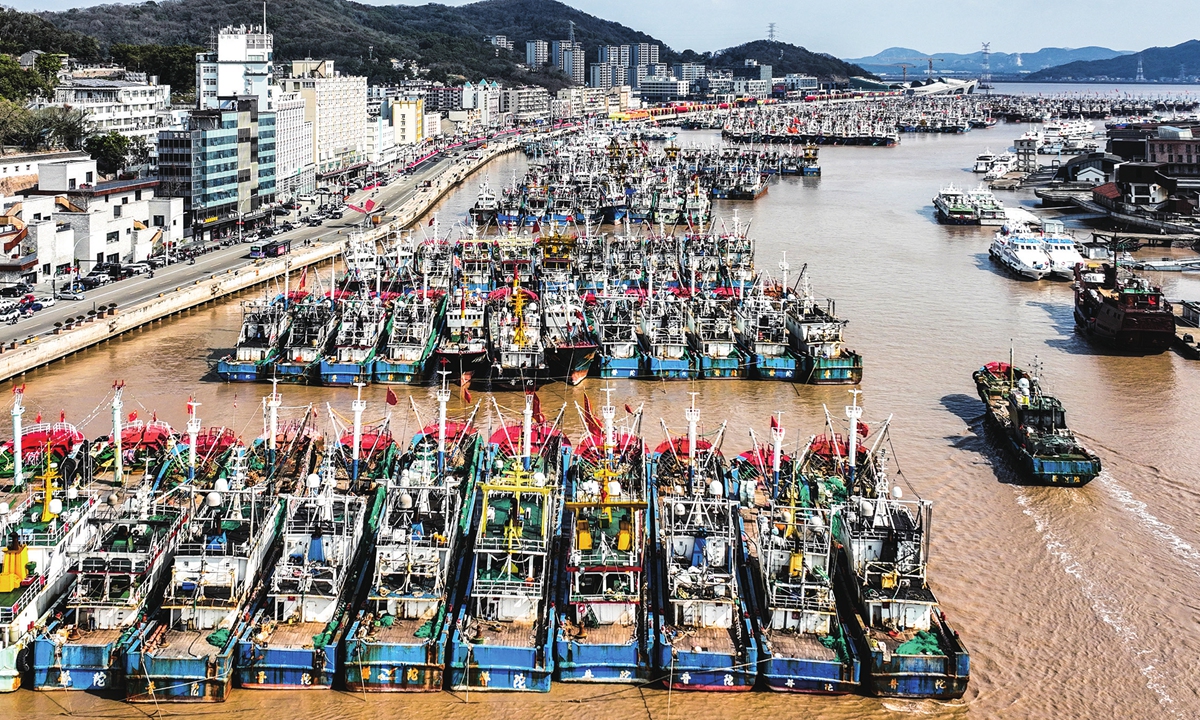 Returning fishing boats line up at a port in Zhoushan island, East China's Zhejiang Province on February 8, 2024. As the Chinese Lunar New Year, also known as the Spring Festival, falls on Friday this year, celebrations of the most important holiday among Chinese people are underway in countries worldwide. Photo: cnsphoto