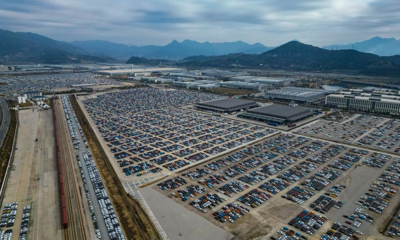 An aerial drone photo taken on Feb. 8, 2024 shows vehicles for export parking at the Ningde land port in Ningde, southeast China's Fujian Province. The Ningde land port, with vehicle transportation railway lines and vehicle loading and unloading platforms, has served as a logistics distribution center and shipment hub for vehicles to be exported to global markets. Photo: Xinhua