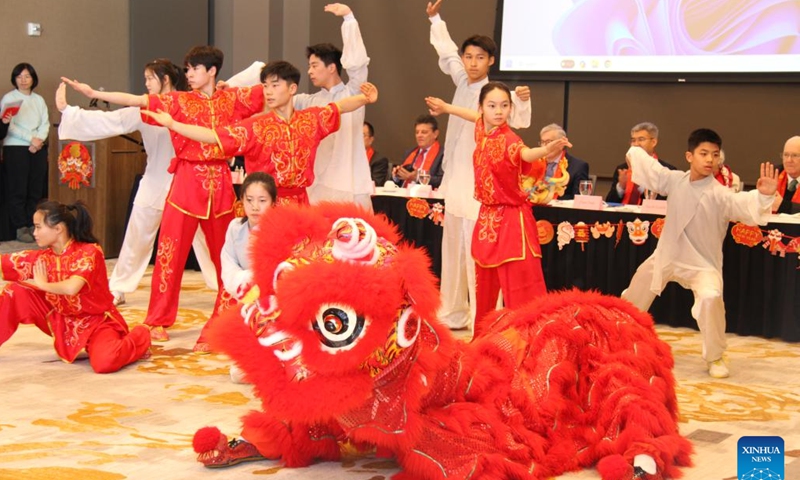 Students of the High School Affiliated to Renmin University of China perform Wushu during an event to celebrate Chinese Lunar New Year in Muscatine, Iowa, the United States, Feb. 9, 2024. (Xinhua/Xu Jing)