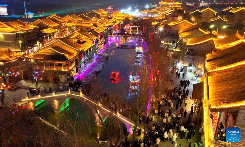 This photo taken on Feb. 10, 2024 shows lighting at Longquan ancient town in Shijiazhuang, north China's Hebei Province.Lighting and appreciating lanterns during the Spring Festival is a time-honored tradition in China. (Photo by Chen Qibao/Xinhua)