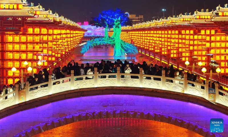 People visit an old block decorated with lighting in Tangshan, north China's Hebei Province, Feb. 10, 2024.Lighting and appreciating lanterns during the Spring Festival is a time-honored tradition in China. (Xinhua/Yang Shiyao)