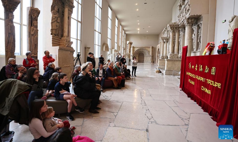 People watch a puppet show staged by Zhangzhou Puppet Troupe from southeast China's Fujian Province at the City of Architecture and Heritage Museum in Paris, France, Feb. 10, 2024. (Xinhua/Gao Jing)