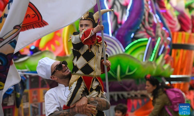 Revelers participate in a carnival parade in Valletta, Malta, Feb. 11, 2024. The historic city of Valletta has become a colorful and musical heaven with marching bands, street performers and dancers as Malta celebrates the carnival from Feb. 9 to 13. (Photo by Jonathan Borg/Xinhua)