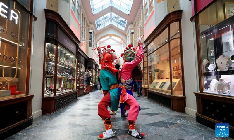 Artists perform Yingge Dance, a form of folk dance popular in south China's Guangdong Province, at Burlington Arcade in London, Britain, Feb. 10, 2024. (Xinhua/Li Ying)