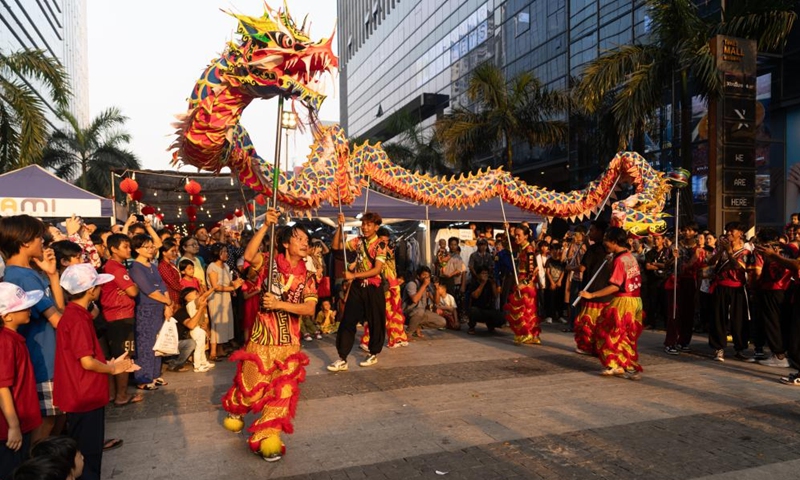 Dragon dancers perform during a celebration event of the Chinese Lunar New Year at a bazaar in Yangon, Myanmar, Feb. 10, 2024.(Photo: Xinhua)