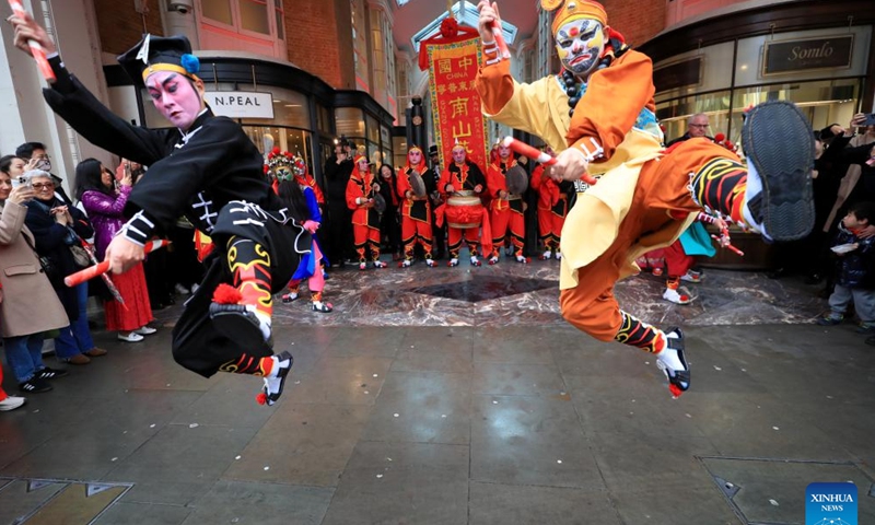 Artists perform Yingge Dance, a form of folk dance popular in south China's Guangdong Province, at Burlington Arcade in London, Britain, Feb. 10, 2024. (Xinhua/Li Ying)