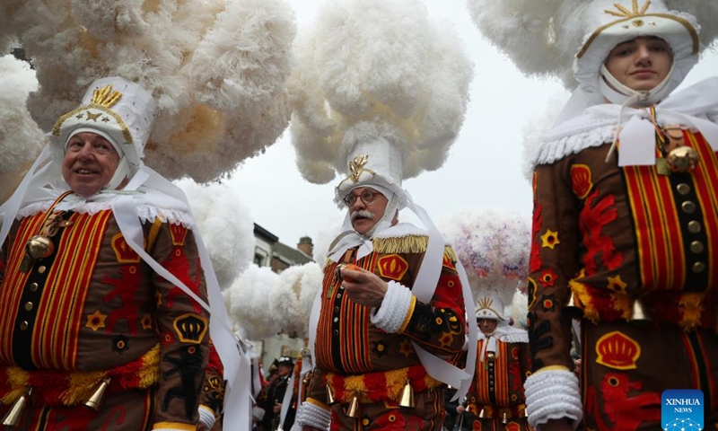 Local residents wearing costumes of Gille attend the parade of Shrove Tuesday, the last day of Carnival, in Binche, Belgium, Feb. 13, 2024. Binche's three-day carnival, a UNESCO World Heritage event and one of the most famous carnivals in Europe, reached its climax on Tuesday. (Photo: Xinhua)