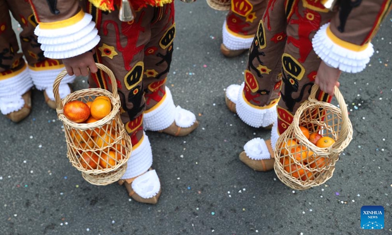 Oranges symbolizing good luck are pictured during the parade of Shrove Tuesday, the last day of Carnival, in Binche, Belgium, Feb. 13, 2024. Binche's three-day carnival, a UNESCO World Heritage event and one of the most famous carnivals in Europe, reached its climax on Tuesday. (Photo: Xinhua)