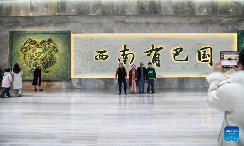 Visitors pose for a photo at the Luojiaba Site Museum in Xuanhan County, southwest China's Sichuan Province, Feb. 14, 2024. Many people choose to spend their Spring Festival holiday by viewing exhibitions in museums. (Photo: Xinhua)