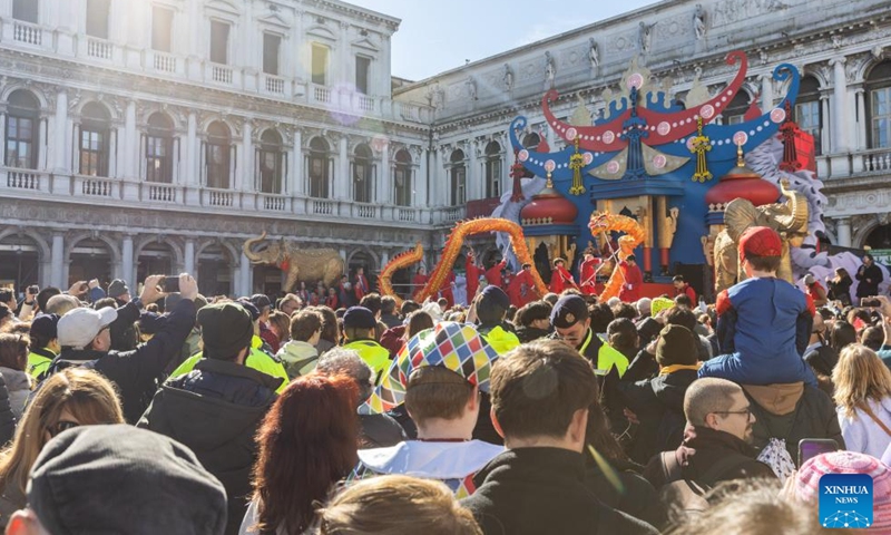 People watch a dragon dance performance at Piazza San Marco in Venice, Italy, Feb. 13, 2024. A Chinese costume show was held on Tuesday as a major event of the carnival season. (Photo: Xinhua)