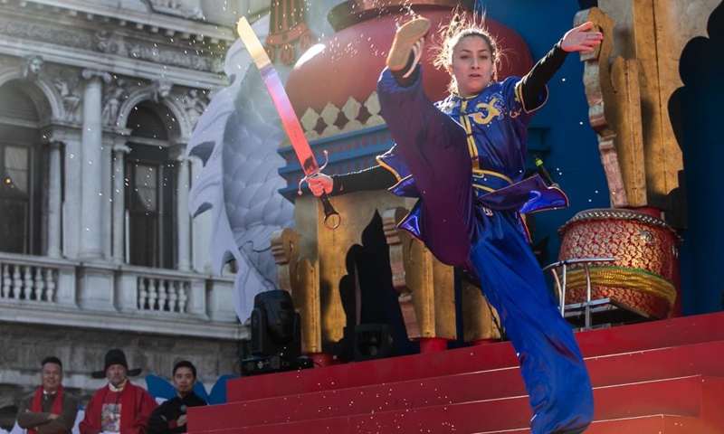 A woman performs Chinese Kungfu at Piazza San Marco in Venice, Italy, Feb. 13, 2024. A Chinese costume show was held on Tuesday as a major event of the carnival season. (Photo: Xinhua)