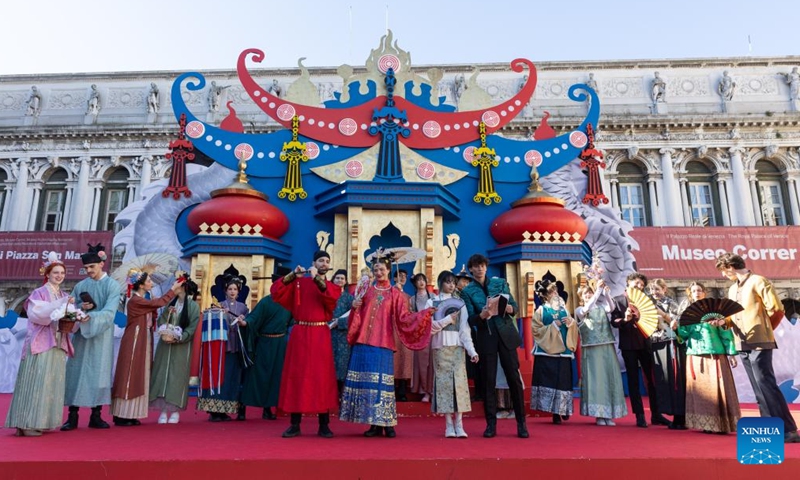 Italian volunteers display Hanfu, a style of clothing traditionally worn by the Han people, at Piazza San Marco in Venice, Italy, Feb. 13, 2024. A Chinese costume show was held on Tuesday as a major event of the carnival season. (Photo: Xinhua)