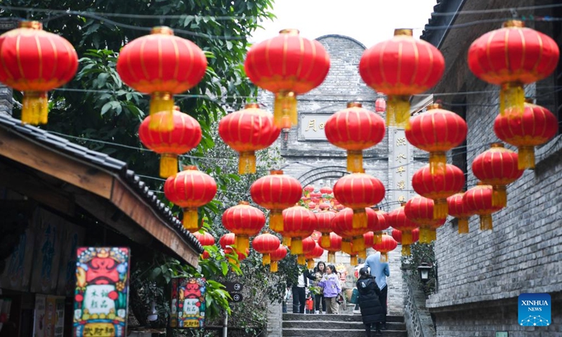 People visit Longmenhao old street in Nan'an District of southwest China's Chongqing Municipality, Feb. 14, 2024. In recent years, various urban renewal measures have been taken in Chongqing to transform old streets, old factories, old buildings into tourism attractions, the gathering place for emerging industries etc.(Photo: Xinhua)