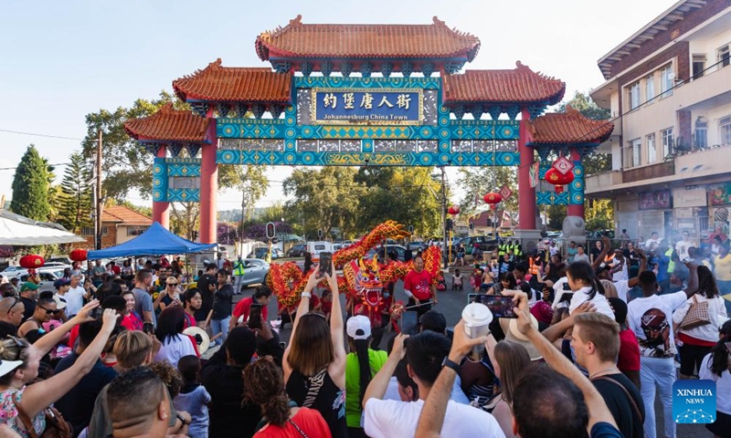 Visitors watch dragon dance at Chinatown in Johannesburg, South Africa, Feb. 17, 2024. A Chinese Lunar New Year Celebration was held here on Saturday.(Photo: Xinhua)