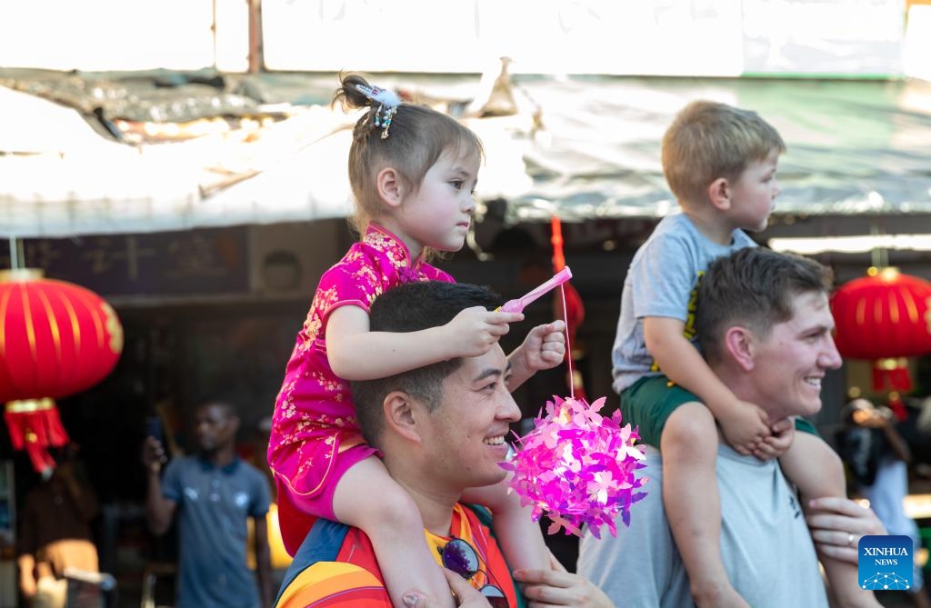 Visitors watch performance at Chinatown in Johannesburg, South Africa, Feb. 17, 2024. A Chinese Lunar New Year Celebration was held here on Saturday.(Photo: Xinhua)