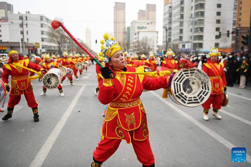 Performers play drums during a Shehuo show in Yuzhong County of Lanzhou, northwest China's Gansu Province, Feb. 20, 2024. Shehuo, a traditional folk celebration in China, is a festivity in multiple forms consisting of dragon dance, lion dance, traditional Chinese opera, drum playing and other folk performances that may vary in different regions.(Photo: Xinhua)