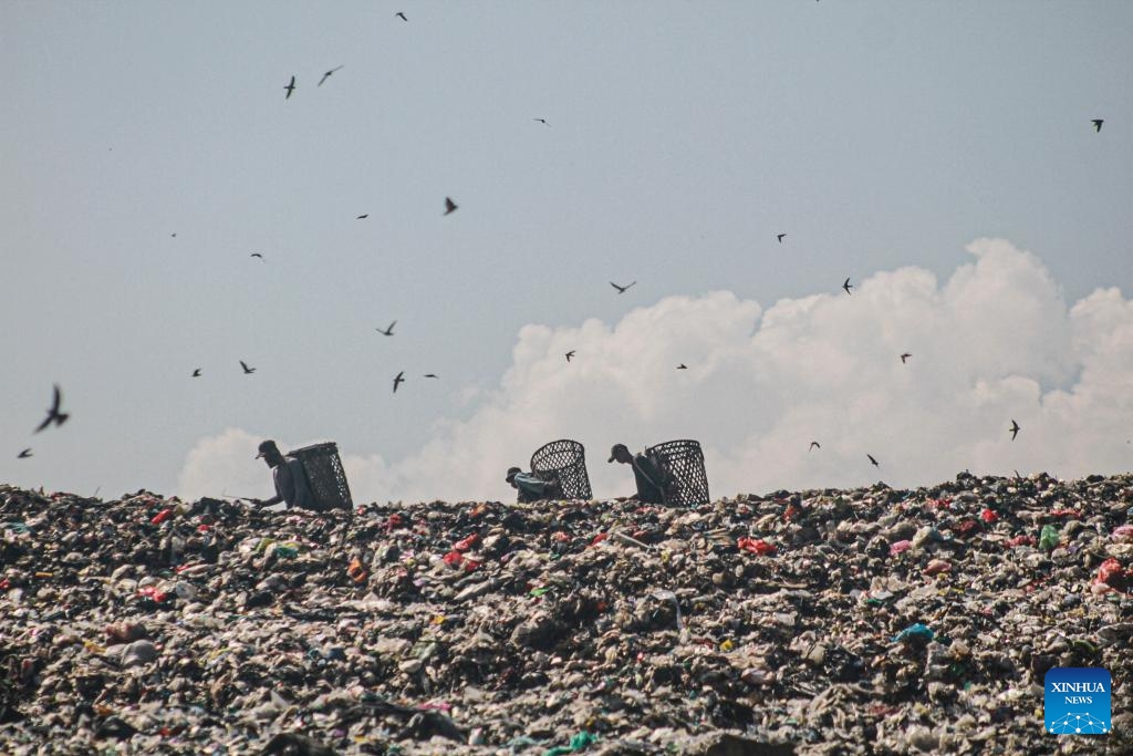 Workers collect plastic waste at Galuga landfill in Bogor, West Java, Indonesia, Feb. 20, 2024.(Photo: Xinhua)