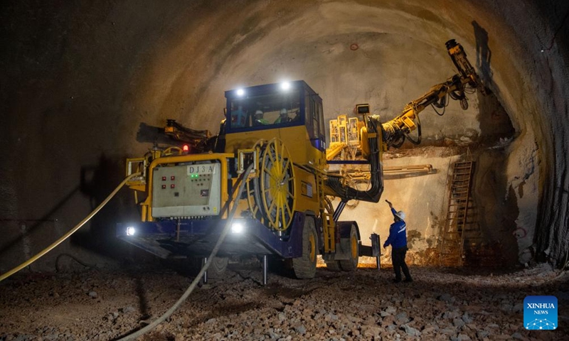 Staff members work at the construction site of the Liusanzhai tunnel of the middle line of the Chengdu-Chongqing high-speed railway in southwest China's Chongqing, Feb. 19, 2024. The middle line of the Chengdu-Chongqing high-speed railway will slash the travel time between the two cities to just 50 minutes after completion.(Photo: Xinhua)