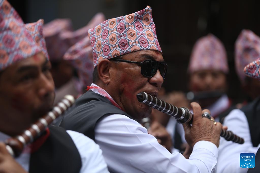 People play musical instruments in a parade during Bhimsen Puja celebration in Lalitpur, Nepal, on Feb. 21, 2024.(Photo: Xinhua)