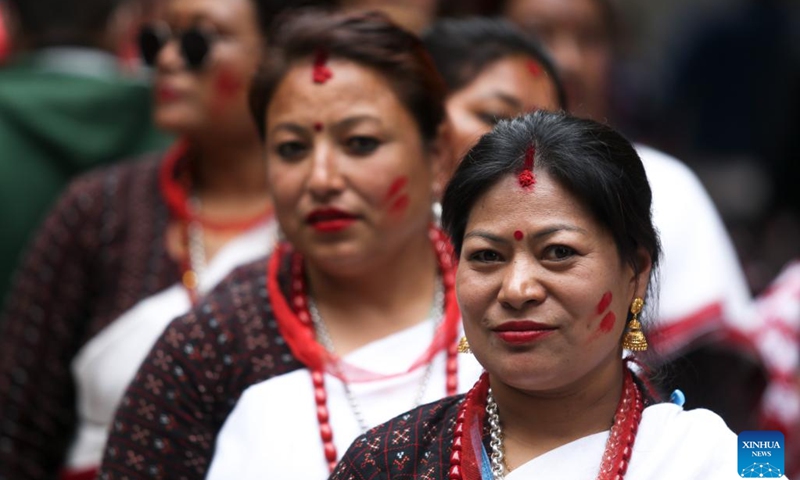 Women take part in a parade during Bhimsen Puja celebration in Lalitpur, Nepal, on Feb. 21, 2024.(Photo: Xinhua)