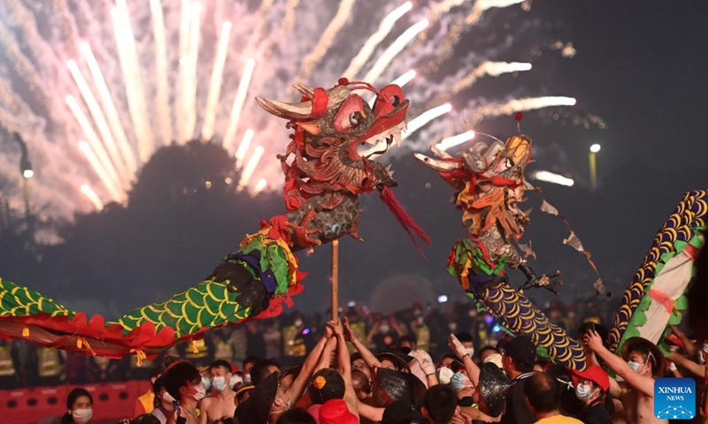 People perform firecracker dragon dance during Firecracker Dragon Festival in Binyang County, south China's Guangxi Zhuang Autonomous Region, Feb. 20, 2024. Firecracker Dragon Festival that can be dated back to more than 10 centuries ago is a traditional carnival celebrating Spring Festival in Binyang, when locals perform the firecracker dragon dance with a bamboo dragon.(Photo: Xinhua)