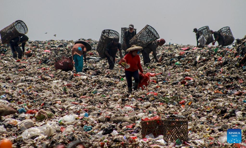 Workers collect plastic waste at Galuga landfill in Bogor, West Java, Indonesia, Feb. 20, 2024.(Photo: Xinhua)