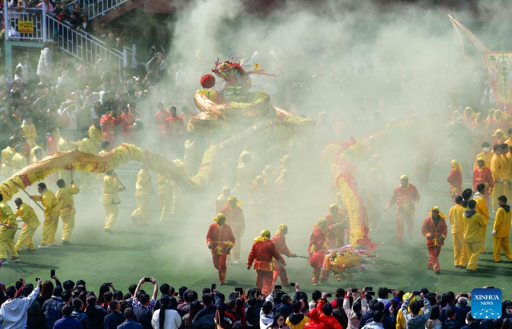 Local people perform dragon dance during the Maolong Festival of Gelao ethnic group in Shiqian County, southwest China's Guizhou Province, Feb. 20, 2024. The festival, as a folk activity for people of the Gelao ethnic group to celebrate the Spring Festival and lantern festival, is listed as one of the national intangible cultural heritages in 2006.(Photo: Xinhua)