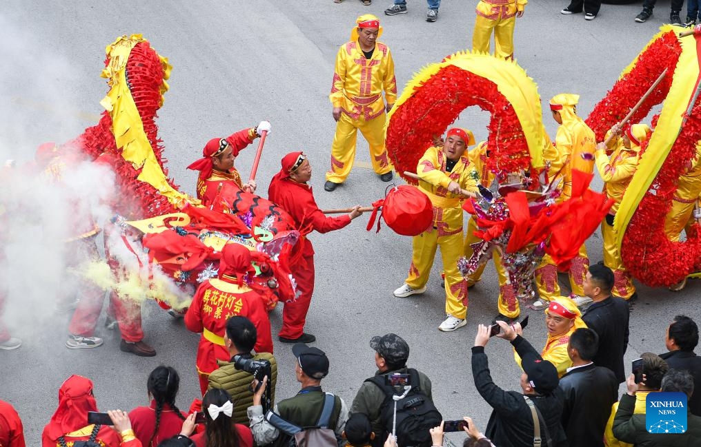 Local people perform dragon dance during the Maolong Festival of Gelao ethnic group in Shiqian County, southwest China's Guizhou Province, Feb. 20, 2024. The festival, as a folk activity for people of the Gelao ethnic group to celebrate the Spring Festival and lantern festival, is listed as one of the national intangible cultural heritages in 2006.(Photo: Xinhua)