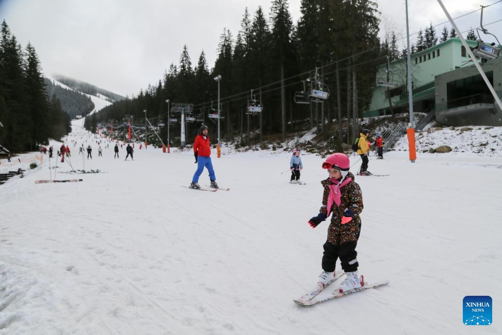 People ski at a winter sports resort in Jasna, Slovakia, Feb. 21, 2024. Jasna greeted lots of visitors to enjoy skiing and snowboarding here in February.(Photo: Xinhua)