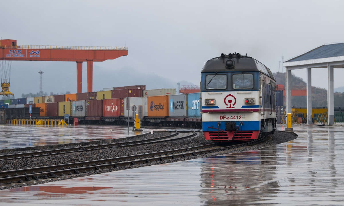 A sea-rail intermodal train loaded with 100 TEUs of thermos cups, folding chairs and other goods departs from a train station in Jinhua City, East China's Zhejiang Province, and heads for Ningbo Zhoushan Port, to ship overseas on February 23, 2024. It is the station's first freight train trip after resumption of work following the Spring Festival. Photo: VCG