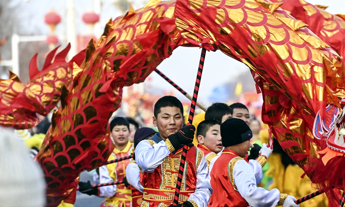 

People in Urumqi, Northwest China's Xinjiang Uygur Autonomous Region, stage a traditional dragon dance performance on February 23, 2024, to usher in the Lantern Festival. The festival falls on February 24 this year. Photo: cnsphoto