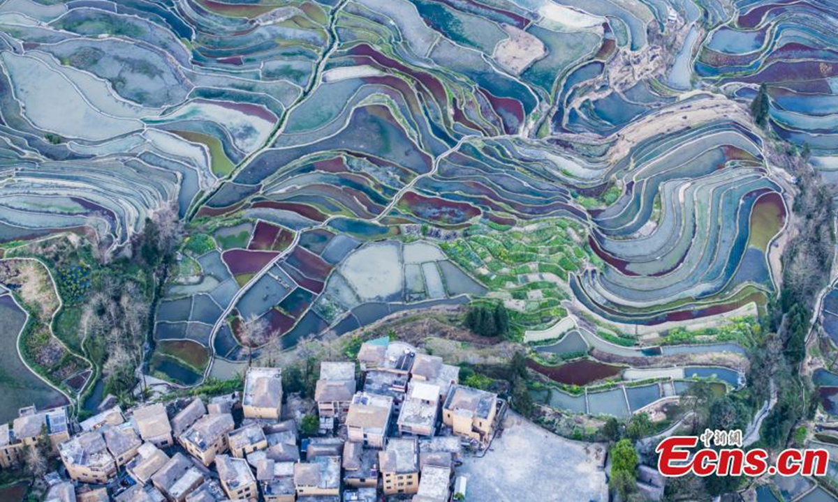 Spectacular aerial view of terraced fields at twilight in Yuanyang County of Honghe Hani and Yi Autonomous Prefecture, southwest China's Yunnan Province, Feb. 19, 2024. (Photo/VCG)