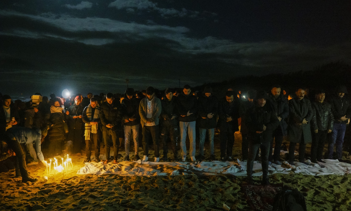 Survivors and relatives of the victims gather for a commemoration and pray on February 26, 2024 at the site where a migrant boat capsized on the same day in 2023 a short distance from the shore in Steccato di Cutro, in the tip of southern Italy, killing at least 94 people. Photo: VCG