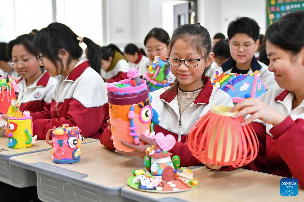 Students display handmade works made during the winter holiday at Zhiyangshan School in Fushan District of Yantai City, east China's Shandong Province, Feb. 26, 2024. The new semester for primary and secondary schools kicked off in many parts of China on Monday.(Photo: Xinhua)