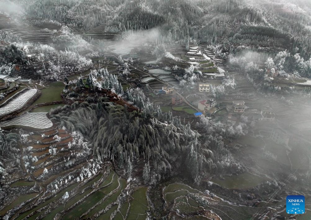 An aerial drone photo taken on Feb. 28, 2024 shows the snow scene in Dayuan Village of Quanzhou County, south China's Guangxi Zhuang Autonomous Region. Affected by a cold front, terraces in Dayuan Village were covered by ice and snow.(Photo: Xinhua)