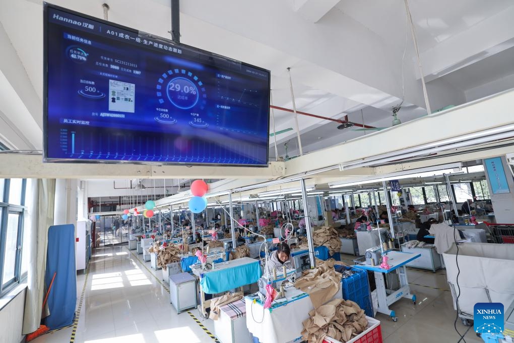 This photo taken on Feb. 27, 2024 shows a digital manufacturing plant for children's garment at Zhili Town of Huzhou City, east China's Zhejiang Province. Zhili, located in the Yangtze River Delta economic circle, is renowned for its children's garment industry, whose complete industrial chain covers design, production, sales, storage, and logistics.(Photo: Xinhua)